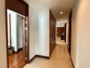 Spacious hallway interior with polished floor and wooden doors