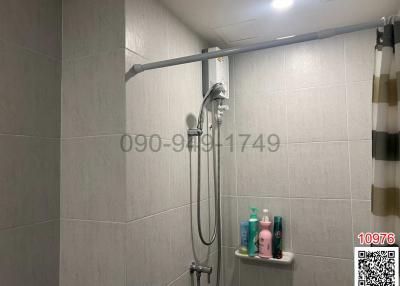 Modern bathroom with shower and neutral tiles