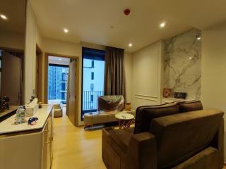 Modern living room with open-plan layout leading to a balcony