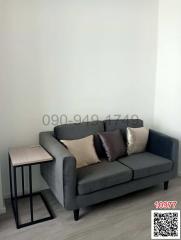 Modern living room with gray sofa and side table