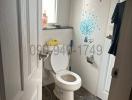 Small white tiled bathroom with natural light from window