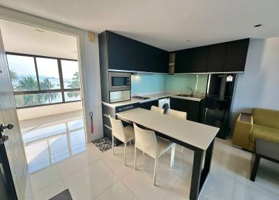 Modern kitchen with integrated dining area and ocean view
