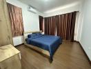 Spacious Bedroom with Modern Furniture and Air Conditioning