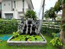 Cozy residential garden with a decorative water fountain