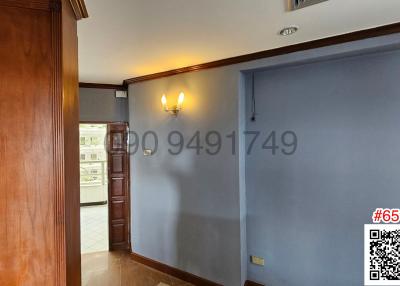 Spacious entrance hall with wood flooring and ample natural light