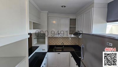 Modern kitchen with stainless steel appliances and white cabinetry