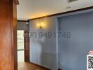 Hallway interior with wooden floors and wall sconces