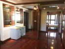 Spacious kitchen with wooden finishes and ample natural light