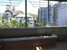 Urban view from a high-rise apartment balcony