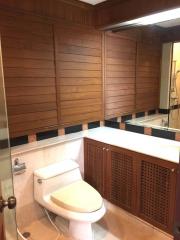 Modern bathroom with wooden finish and elegant fixtures