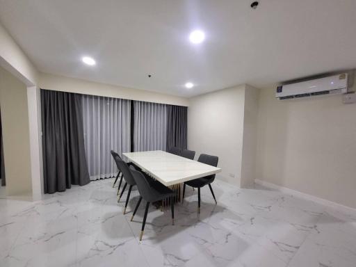 Spacious dining room with modern table and seating for eight