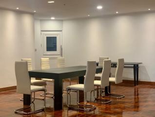 Modern dining room with a large table and comfortable chairs