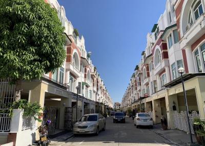 Residential street view with row of townhouses