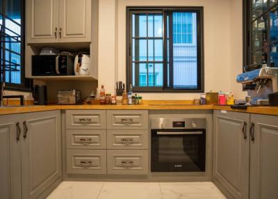 Modern kitchen with stainless steel appliances and wooden cabinets