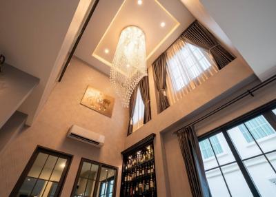 Elegant living room with high ceiling and chandelier