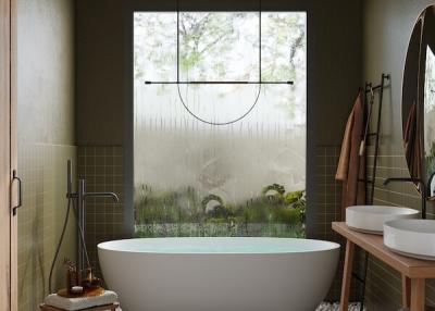 Modern bathroom with a freestanding tub and large window