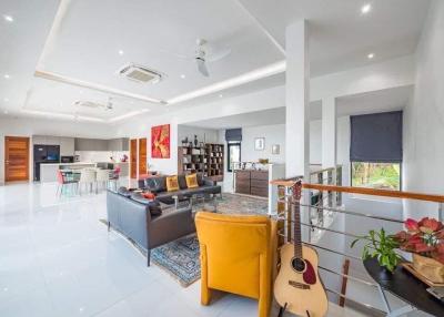 Spacious modern living room with open plan design and abundant natural light