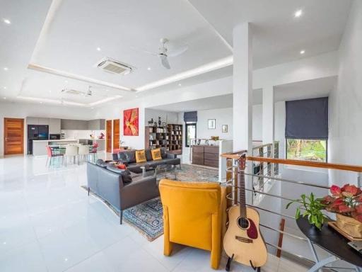 Spacious modern living room with open plan design and abundant natural light