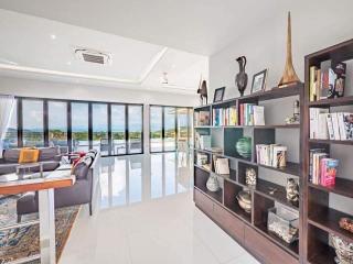 Spacious living room with large windows and contemporary design