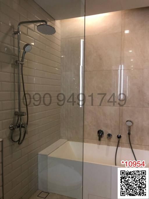 Modern bathroom with glass shower and tiled walls