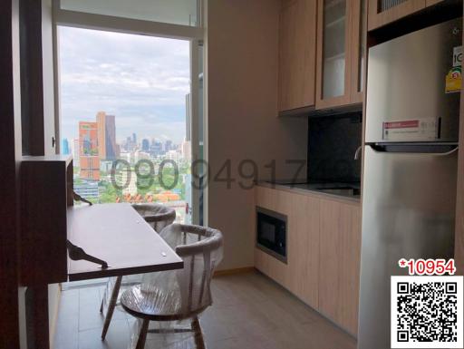 Compact modern kitchen with city view through large windows