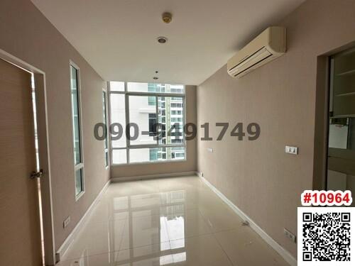 Spacious unfurnished living room with large windows and natural light