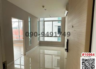 Spacious and brightly lit living room with large windows