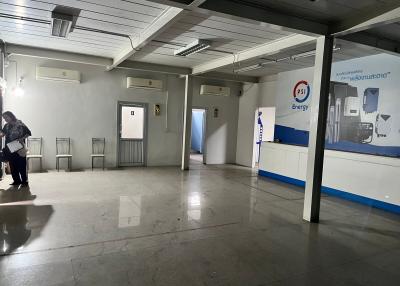Spacious commercial building interior with tiled floors and reception area