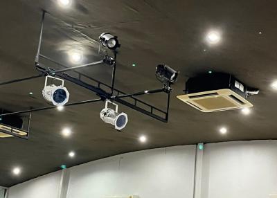 Ceiling with lighting and surveillance cameras