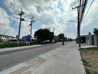 Street view in front of residential area with visible infrastructure