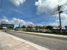 Street view of the property with clear skies