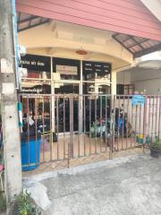 Exterior view of a building with a gated entrance