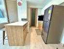 Modern kitchen with wooden finish and full-sized appliances
