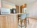 Modern kitchen with a breakfast bar and wooden finishes