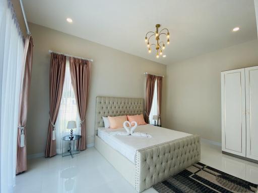 Elegant bedroom with queen-sized bed and modern decor