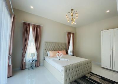 Elegant bedroom with queen-sized bed and modern decor