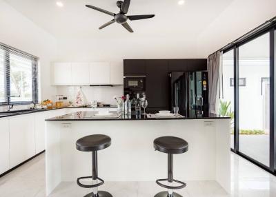 Modern kitchen with island and bar stools