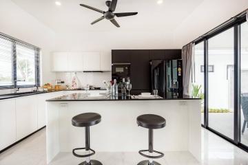 Modern kitchen with island and bar stools