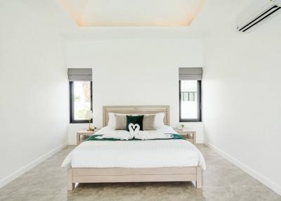 Spacious and bright modern bedroom with a large bed and clean design