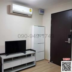 Compact living room with modern furniture and air conditioning unit