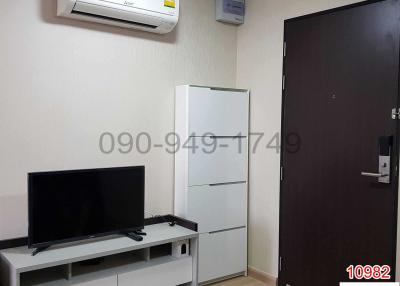 Compact bedroom with modern amenities and air conditioning