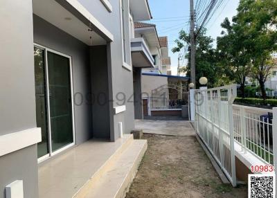Modern home exterior with well-maintained pathway and fencing
