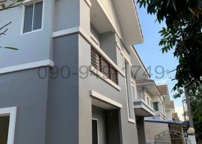 Exterior view of a modern two-story residential building with balcony