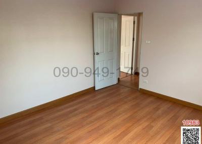 Empty bedroom with wooden floor