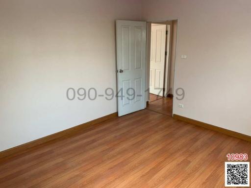 Empty bedroom with wooden floor