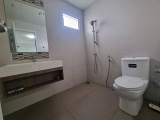 Modern bathroom with shower, toilet, and sink