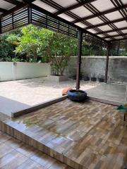 Spacious covered outdoor patio with tiled flooring
