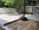 Spacious covered outdoor patio with tiled flooring