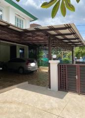 Suburban house with carport and driveway