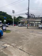 Street view with convenience store and parking area